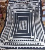 Large cotton carpet, in black and white geometric design, 180 x 272cm