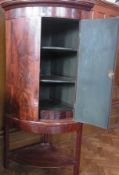 19th century mahogany bowfronted corner cupboard, enclosing three shelves and three small drawers on