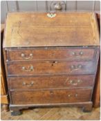 Early 19th century oak bureau, the fall-front with fitted interior, four long graduated drawers on