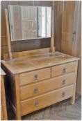 20th century oak dressing table of two short and two long drawers with rectangular bevelled