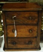 A Victorian walnut miniature chest of three drawers, width 36ms