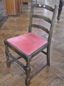 A set of four nineteenth century stained wood ladderback dining chairs with pink upholstery drop