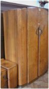 An early 20th century Lebus HL walnut veneered wardrobe, pair doors enclosing mirror, shelves and