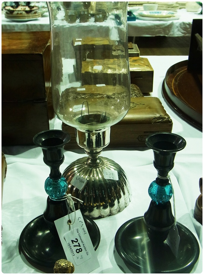 A white metal (possibly Italian) storm candle holder with glass chimney, overall height 30cm, and