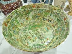 Chinese famille rose Canton bowl, decorated with scholars in panels, flora and butterflies within