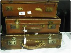 Three small leather suitcases together with a leather satchel containing agricultural notes circa