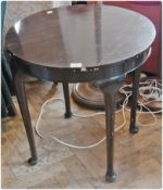 A mahogany circular top combination tea and card table, the interior lined with green baize, on