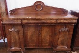 William IV mahogany sideboard, having shaped raised back with scroll and wreath carving, the cushion