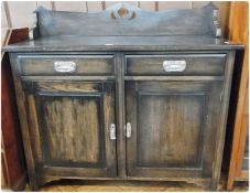 Edwardian stained oak sideboard with Art Nouveau style handles to drawers and cupboards, 120cm wide