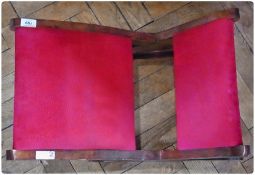 Stained wood gout stool, upholstered in red dralon