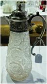 Cut glass claret jug, with silverplated mounts to lid and handle depicting middle eastern designs (