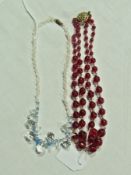 Red glass bead necklace and a blue and clear glass necklace (2)