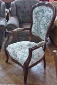 Victorian style balloonback open armchair with cream and green upholstery on cabriole legs