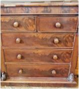 A Victorian mahogany chest of drawers, the rectangular shaped top above two short and three long