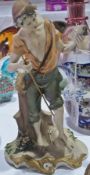 Capodimonte figure of boy holding fish and rod