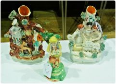 Two various nineteenth century Staffordshire flatback figure groups spill vases together with a