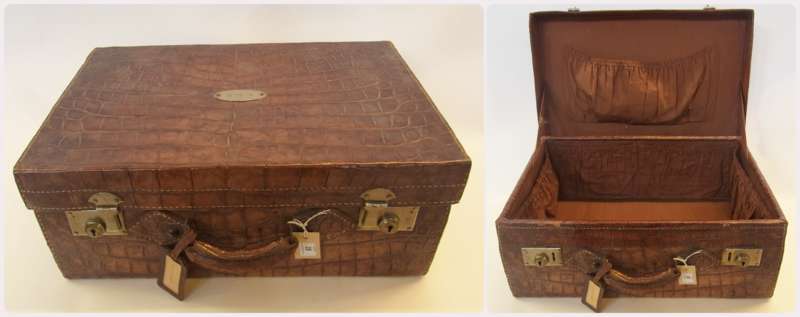 Vintage crocodile suitcase, lined, studs to base, the top lid with a silver-coloured metal plaque