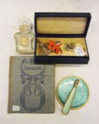 A small photograph album, the covers Art Nouveau design, a selection  of various costume jewellery