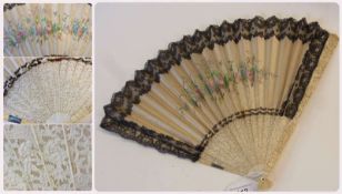 Chinese carved ivory black lace and painted cream satin folding fan, the leaf with rose spray