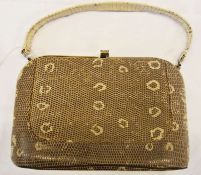 A vintage snakeskin (?) fixed frame handbag with central compartment, zipped