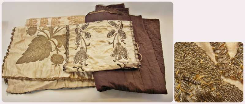 A square satin tablecloth (?), heavily embroidered in silver-coloured metal thread, showing exotic