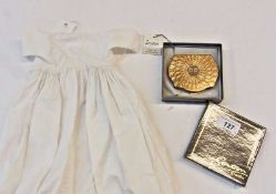 Stratton initial powder compact, cased, and a Victorian doll's dress, (2)