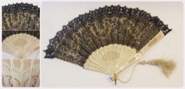 Black lace and cream satin folding fan with scrolling foliate decoration and pierced ivory