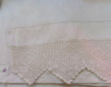 A quantity of table linen including:- two embroidered muslin tablecloths, eight lace place mats, six