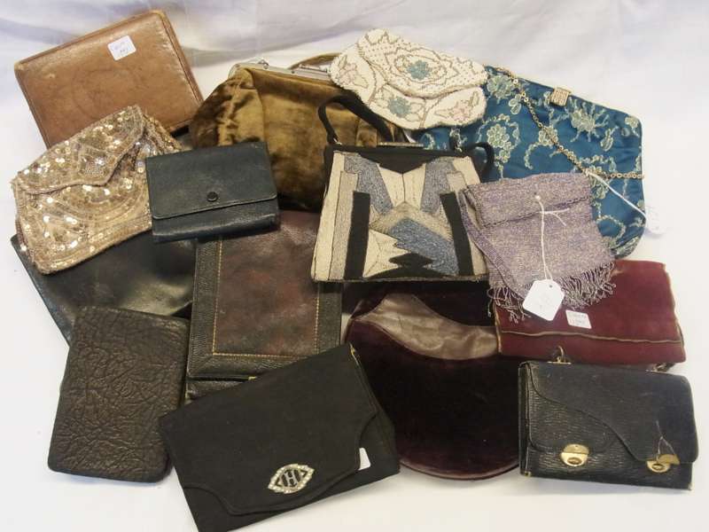 A selection  of vintage evening bags including:- a circular velvet bag, a fixed frame velvet bag,