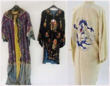 An oriental style silk embroidered coat, black ground, a 1920's oriental style long coat,