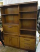 1970's teak sideboard with open shelves, fall-flap cupboard, another and nest of drawers, 138cm wide