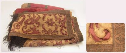 Possibly late 17th century embroidered hanging, linen-backed, very worn with metal fringing, a