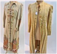 A linen housecoat, lavishly embroidered with flowers and leaves, with a gold brocade housecoat,