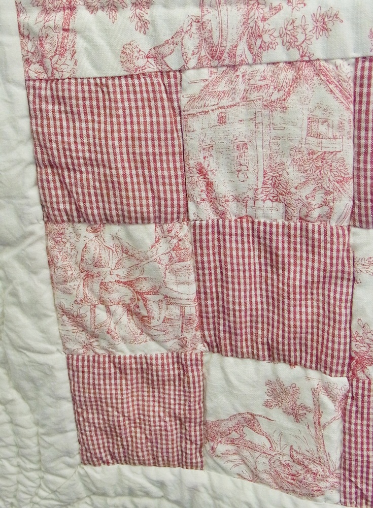 A Walton and Co Ltd cream and pink quilt, the material "toile du joi" with a gingham check (double