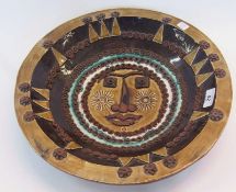 Studio pottery bowl, troika style with raised decorations, showing a face in the centre of the