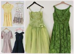 A green chiffon and lace 1950's cocktail dress with diamante straps, a yellow satin dress, a green