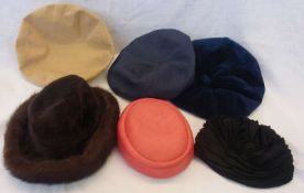 A faux leather black hatbox and various hats including:- an Otto Lucas for Fortnum & Mason mink