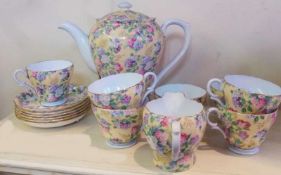 Shelley tea service, printed with lilac flowers on a yellow ground, six cups, six saucers, jug,