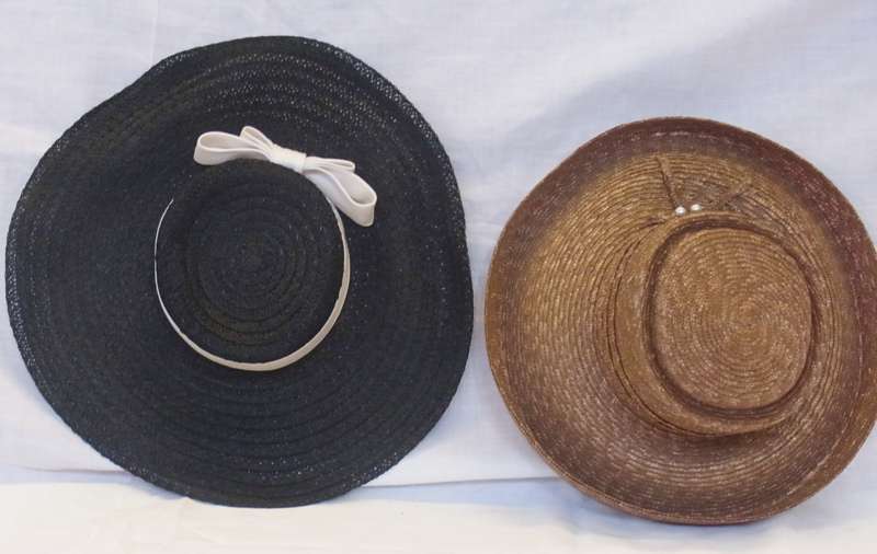 Two various straw hats in a Herbert Johnson hatbox