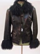 A black leather jacket with mongolian lamb collar and cuffs, labelled 'Cuir, Oscar Leopold