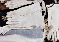 A large quantity of kid gloves, some embroidered, and a swansdown/maribou scarf backed with silk (