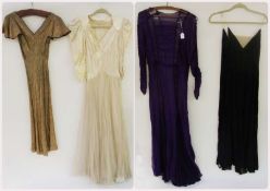 A cream satin 1930's dress with a net skirt, a purple chiffon and lace long evening dress, a black