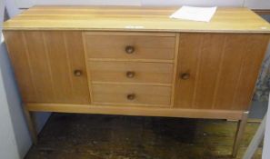 Gordon Russell walnut and hardwood sideboard, the top with channelled edge, fitted three central