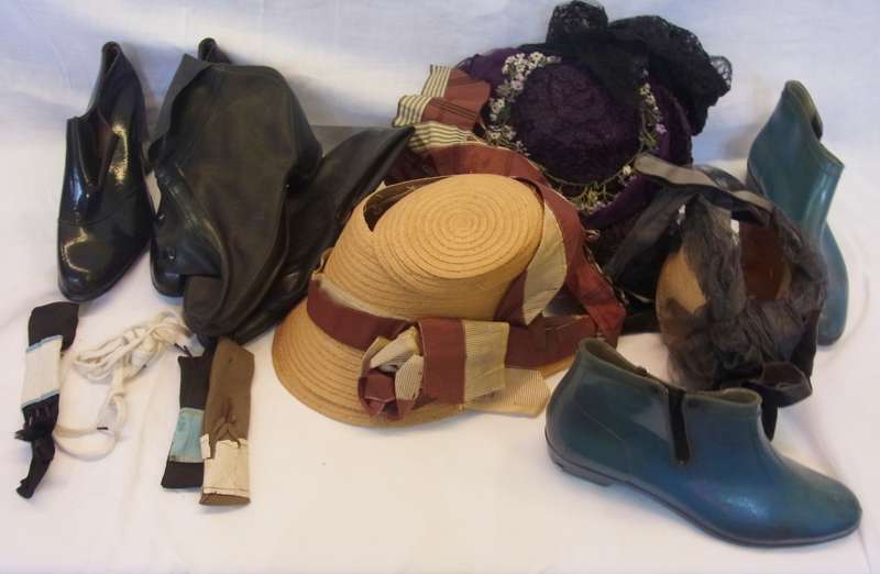 Various Edwardian bonnets, galoshes, and two hatboxes