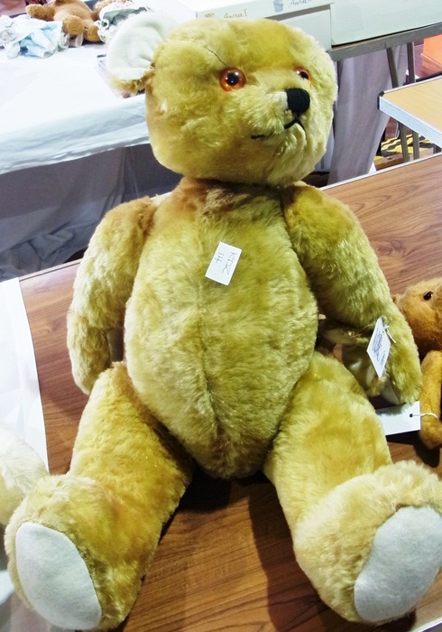 Large gold plush teddy bear, with stitched snout, (one ear missing)