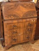 Twentieth century walnut veneer bureau with fitted interior, three long drawers on bracket feet,