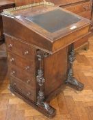 A Victorian walnut Davenport with brass gallery surround, inset leather writing surface, fitted