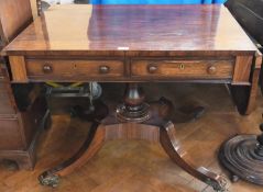 A Regency rosewood sofa table, the rectangular top with D-end drop leaves, two cockbeaded drawers
