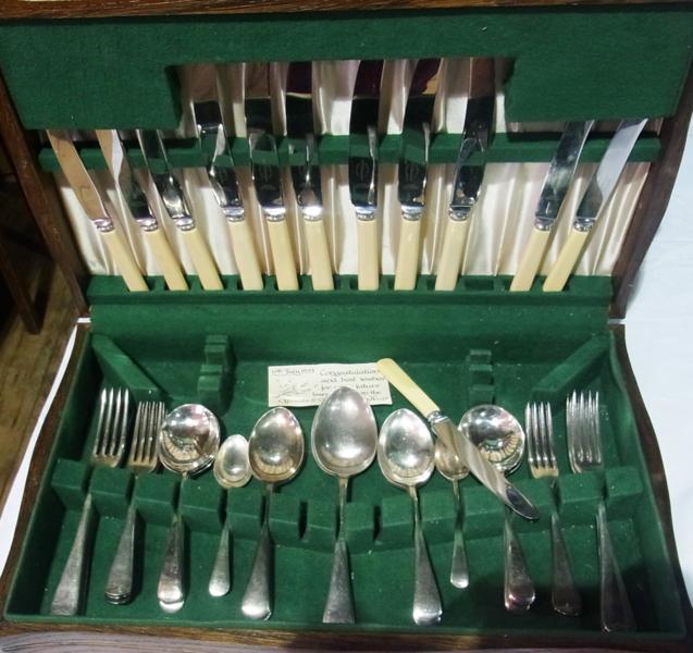 A part canteen of silverplate cutlery to include:- six dinner knives, forks, tablespoons, soup