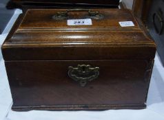 Nineteenth century mahogany caddy, rectangular with shaped top and having brass swan-neck handle,